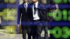 Pedestrians are reflected on an electric stock board of a securities firm in Tokyo, Monday, Feb. 27, 2012.  Japan's Nikkei 22