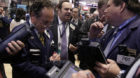 Traders work on the floor of the New York Stock Exchange Friday, March 2, 2012. Stock indexes were mixed in early trading Fri