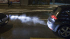 Fumes from a car's exhaust evaporate in the cold winter air, pictured on January 5, 2010 on Badenerstrasse street in Zurich, 