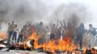 epa03740131 People burn documents from Pakistan's state-owned electricity supply company offices during a protest against pro