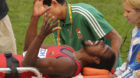 Ecuador's Diego Ferrin is carried off the field after he injured his leg in a men's high jump qualification at the World Athl