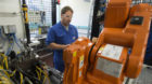 Bucher Hydraulics employee Andreas Boxler adjusts the robot for automatic testing of cartridge valves, pictured on November 2