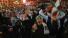 Algerian people celebrate their victory after the World Cup qualifying playoff second leg soccer match against Burkina Faso, 
