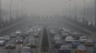epa04023451 A general view of a main road amidst haze in Beijing, China, 16 January 2014. Reports stated that local governmen