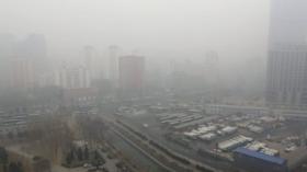 epa04100927 Beijing's skyline is barely visible due to heavy smog, which has blanketed China's capital for seven straight day
