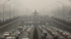 epa02597221 Heavy smog lingers in the air as vehicles drive along a congested thoroughfare in central Beijing, China, 23 Febr