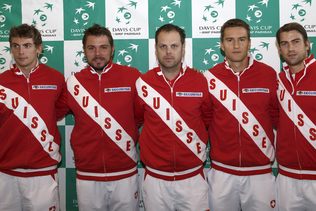 Swiss Davis Cup Team captain Severin Luethi, centre, poses with his players Henri Laaksonen, left, Stanislas Wawrinka, 2nd left, Marco Chiudinelli, 2nd right, and Michael Lammer, right, during the press conference of the Swiss Davis Cup Team prior to the 