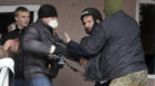 Masked pro-Russian men attack British photojournalist Frederick Paxton, 2nd right, during the mass storming of a police stati