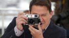 Cast member Channing Tatum takes pictures during a photocall for the film "Foxcatcher" in competition at the 67th Cannes Film