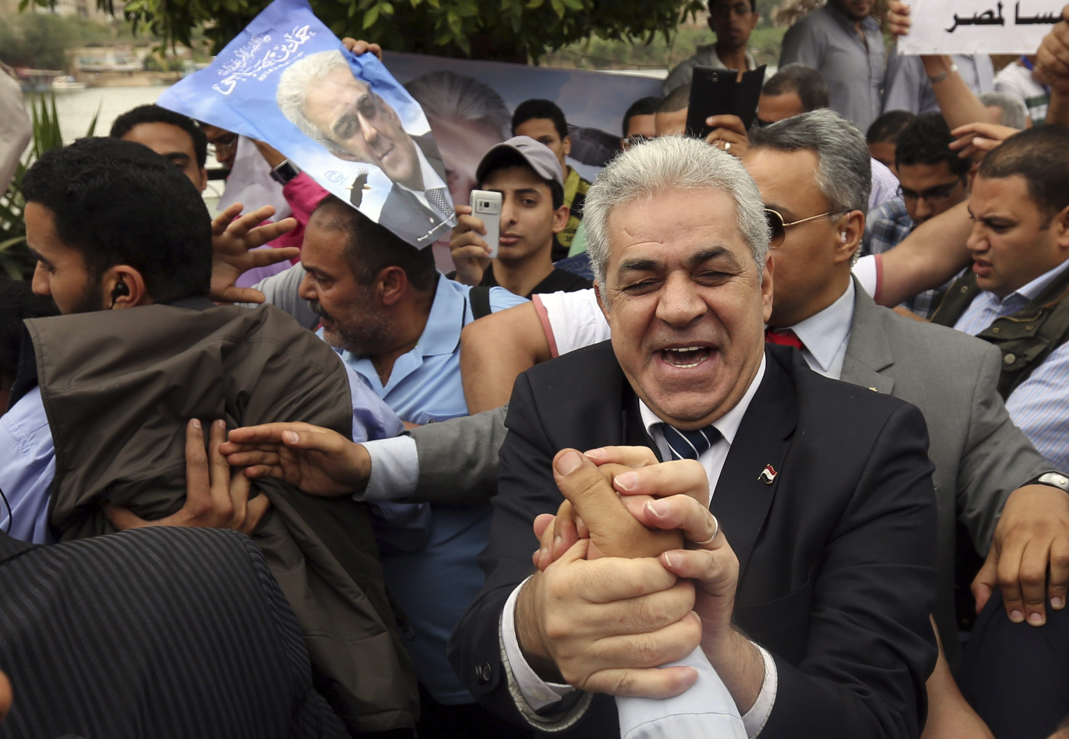 Egypt's leftist presidential candidate Hamdeen Sabahi shakes hands with supporters before a rally in Banha, northwest of Cairo May 7, 2014. Egyptians will vote in presidential elections on May 26 and 27.  REUTERS/Mohamed Abd El Ghany (EGYPT - Tags: POLITI