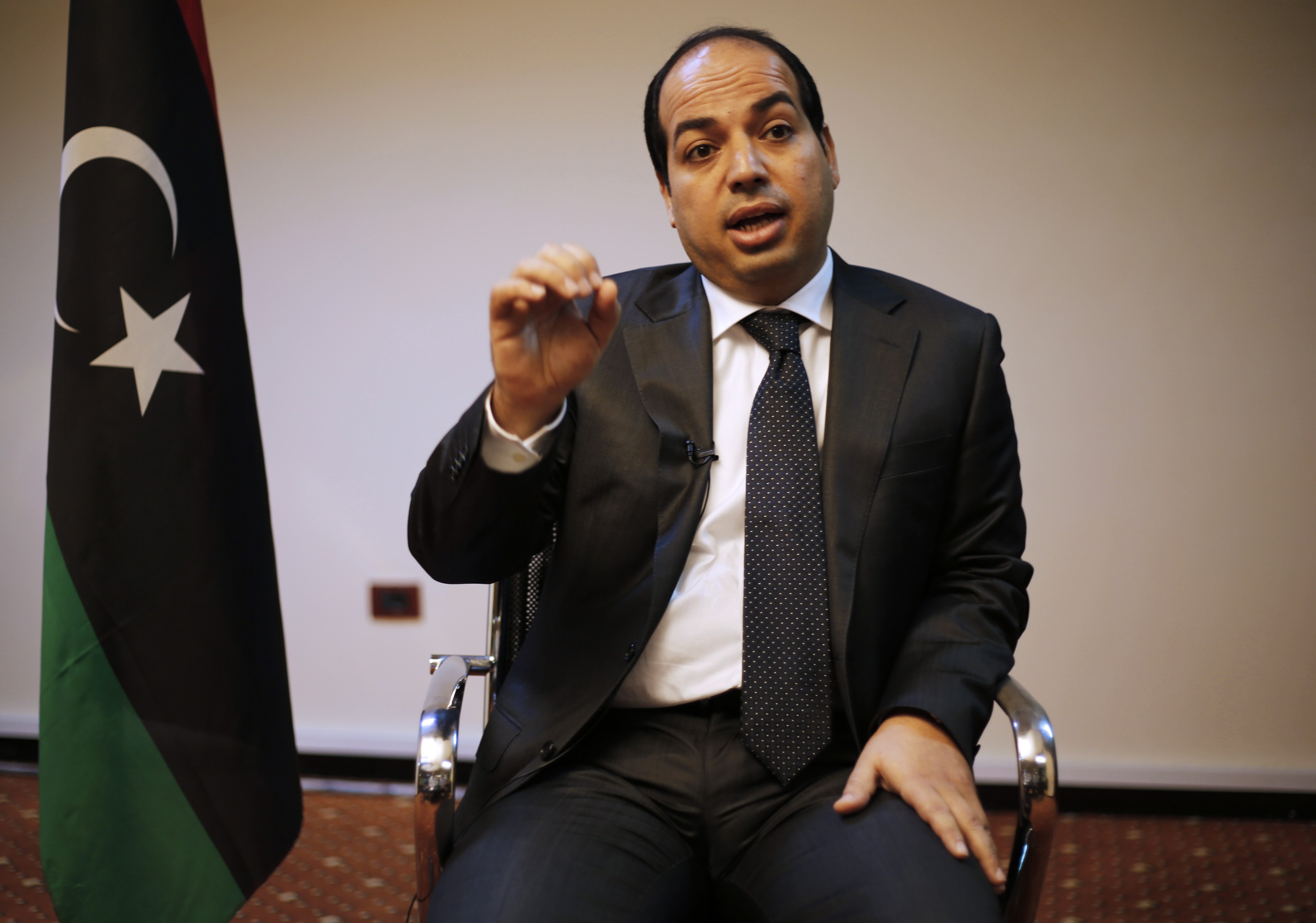 Libya's new Prime Minister Ahmed Maiteeq talks during an interview with Reuters journalists in Tripoli May 26, 2014. Libya's new premier said on Monday his government will focus on fighting militants, securing borders and strengthening the military with t