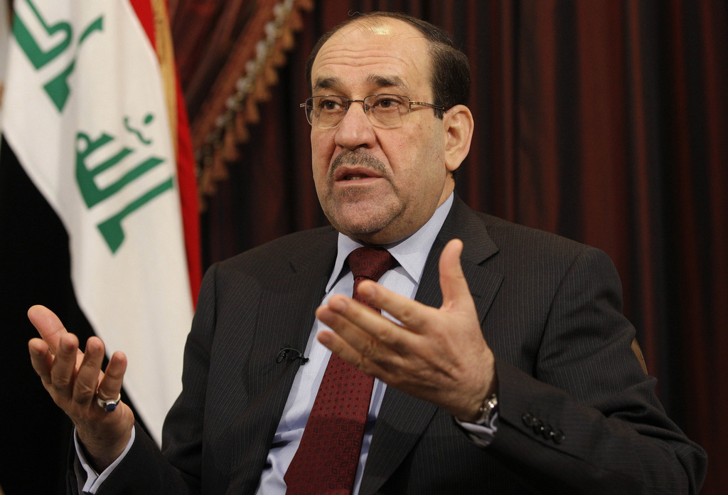 FILE - In this Dec. 3, 2011, file photo, Iraq's Shiite Prime Minister Nouri al-Maliki talks during an interview with The Associated Press in Baghdad, Iraq. As a Sunni Muslim insurgency gains ground in Iraq, the United States is pondering whether the viole
