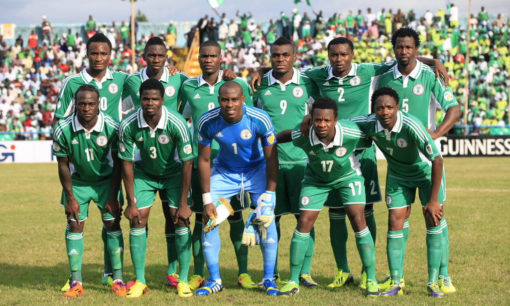 FILE - In this Nov. 16, 2013 file photo, Nigeria soccer team poses prior to start the World Cup qualifying match between Nigeria and Ethiopia at U. J. Esuene Stadium, in Calabar, Nigeria. Background from left:  Mikel John Obi, Omeruo Kenneth, Ideye Brown,