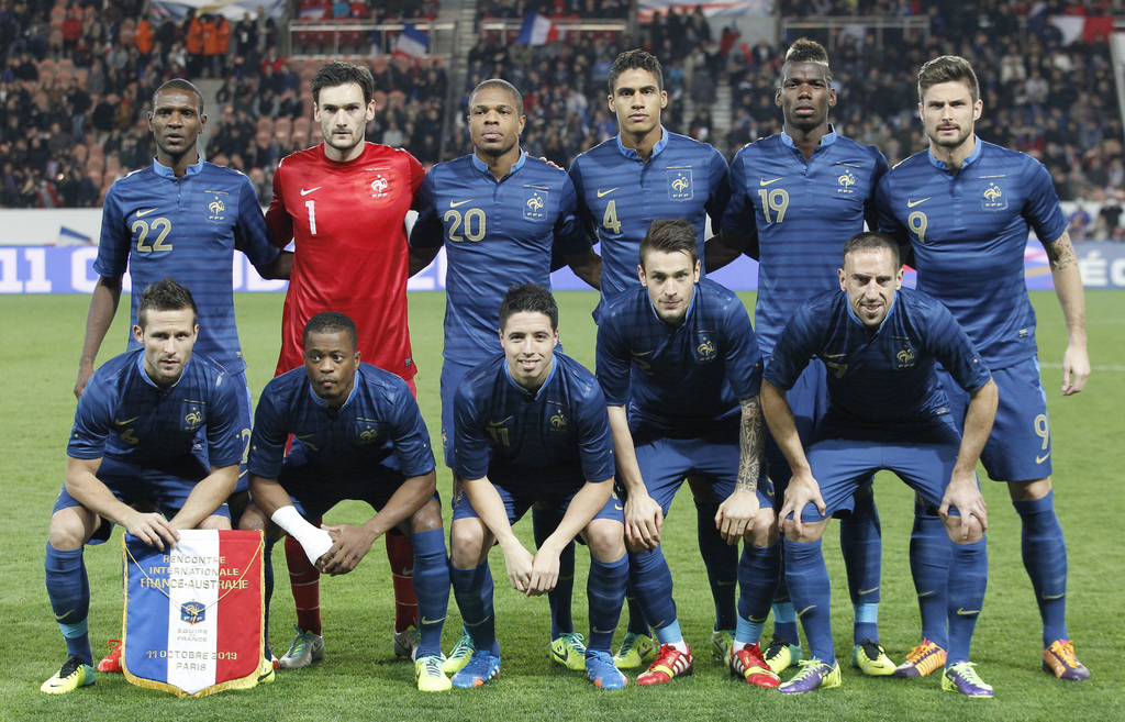 FILE - In this Oct. 11, 2013 file photo, France soccer team poses poses prior to the start their international soccer friendly match between France and Australia at the Parc Des Princes stadium in Paris, France. Background from left: Eric Abidal, Hugo Llo