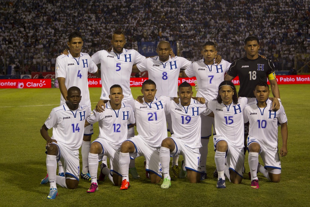 FILE- In this June 11, 2013 file photo, Honduras national soccer team poses prior to the start the 2014 World Cup qualifying soccer match between Honduras and Jamaica in Tegucigalpa, Honduras. Background from left: Juan Montes, Victor Bernardez, Wilson Pa