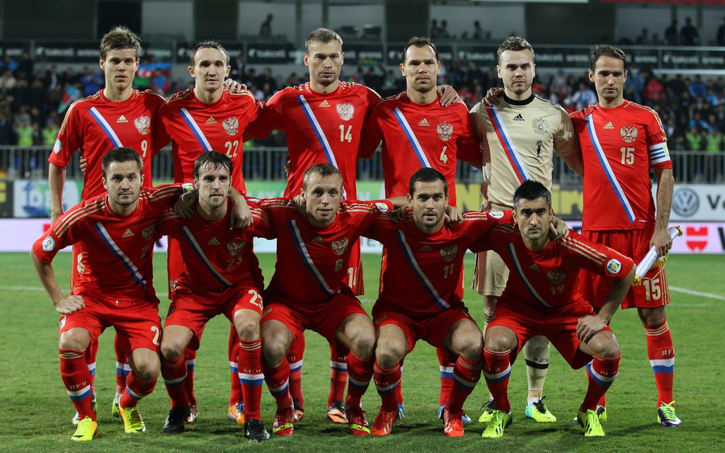FILE - In this Oct. 15, 2013 file photo, Russia national team poses prior to the start the World Cup Group F qualifying soccer match between Russia and Azerbaijan in Baku, Azerbaijan. Foreground from left: Victor Faizulin, Dmitry Kombarov, Denis Glushakov