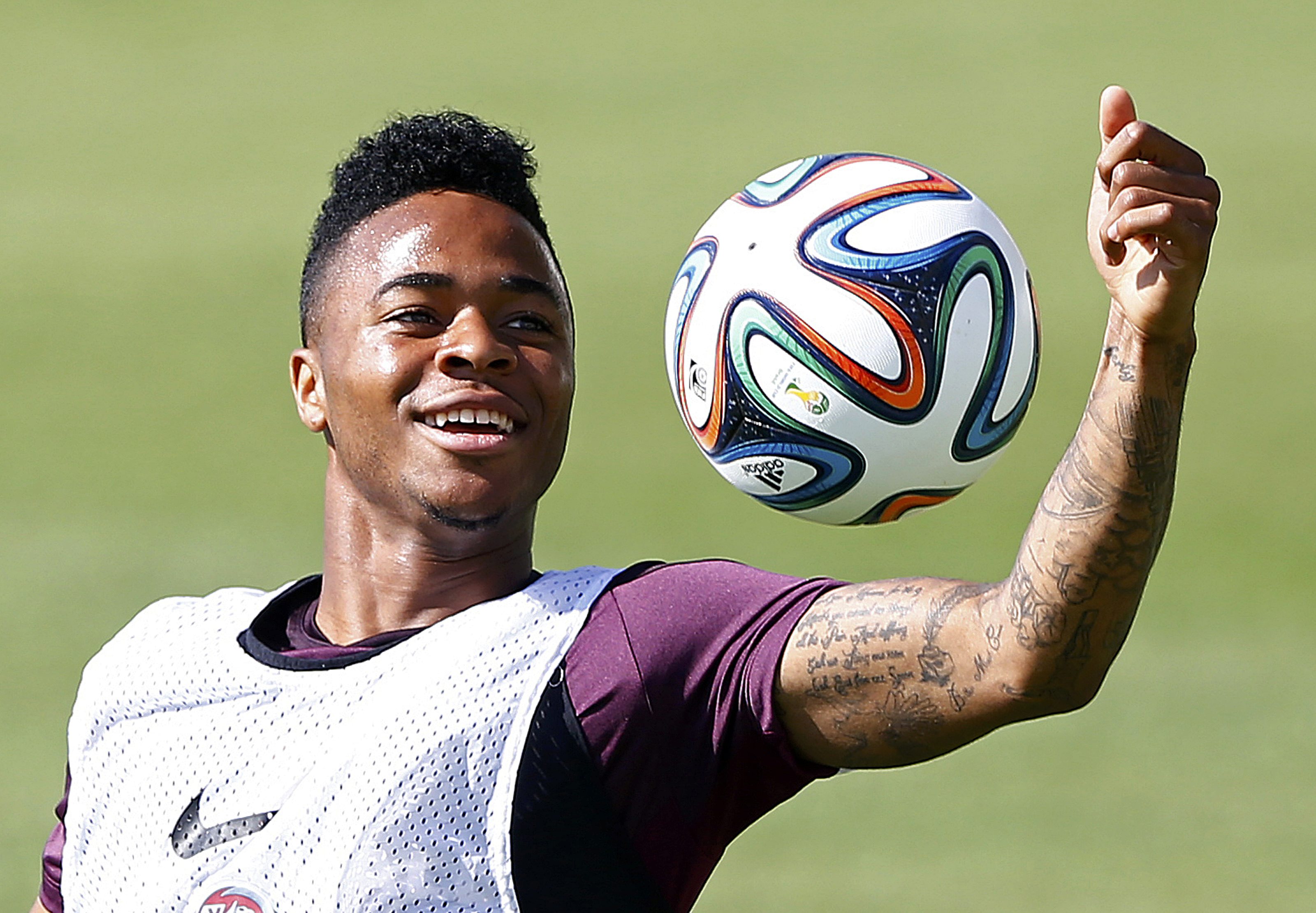England's Raheem Sterling catches the ball during a soccer training session ahead of the 2014 World Cup in Rio de Janeiro, June 9, 2014.    REUTERS/Darren Staples (BRAZIL  - Tags: SOCCER SPORT WORLD CUP)  
