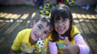 epa04251006 Young Brazilian fans pose for photos outside the Arena Corinthians stadium in Sao Paulo, Brazil, 11 June 2014. Th