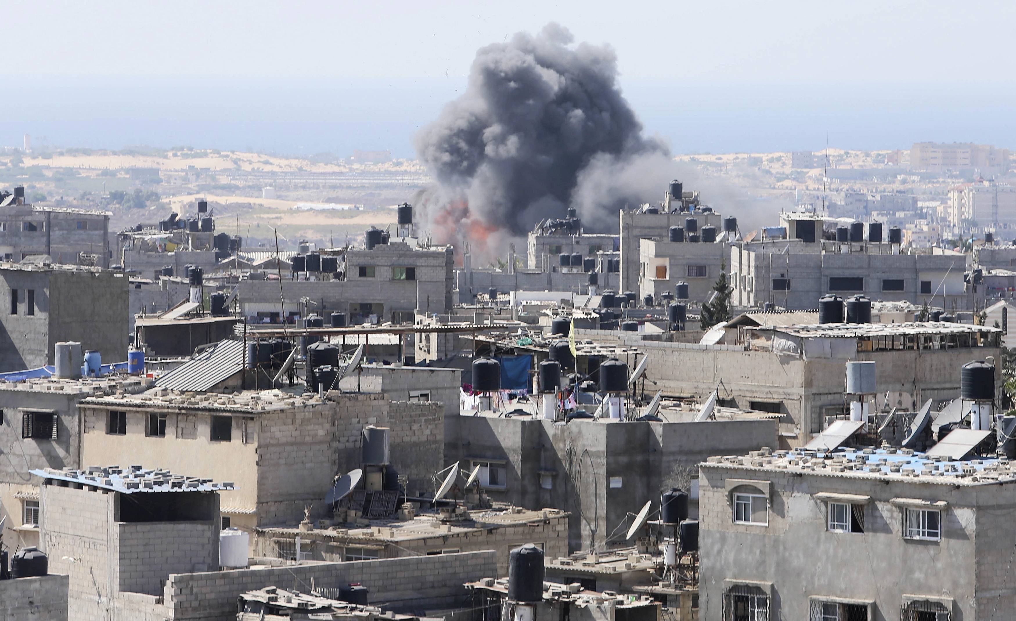 Smoke and flames are seen following what Palestinian witnesses said was an Israeli air strike in Rafah in the southern Gaza Strip July 10, 2014. At least 74 Palestinians, most of them civilians, have been killed in Israel's Gaza offensive, Palestinian off