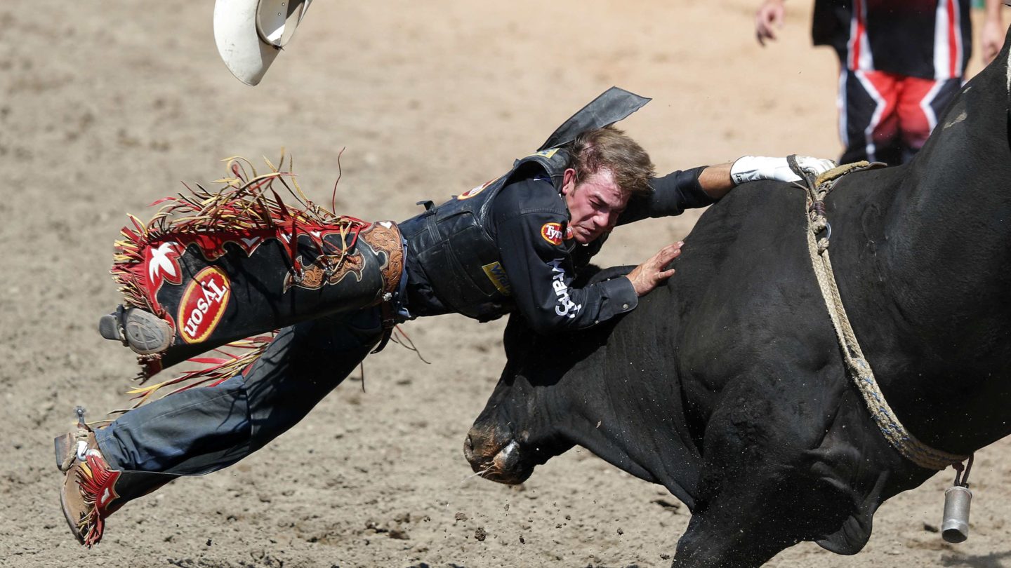 Chase Outlaw of Hamburg, Arizona gets bucked off the bull Crazy Bull in the...