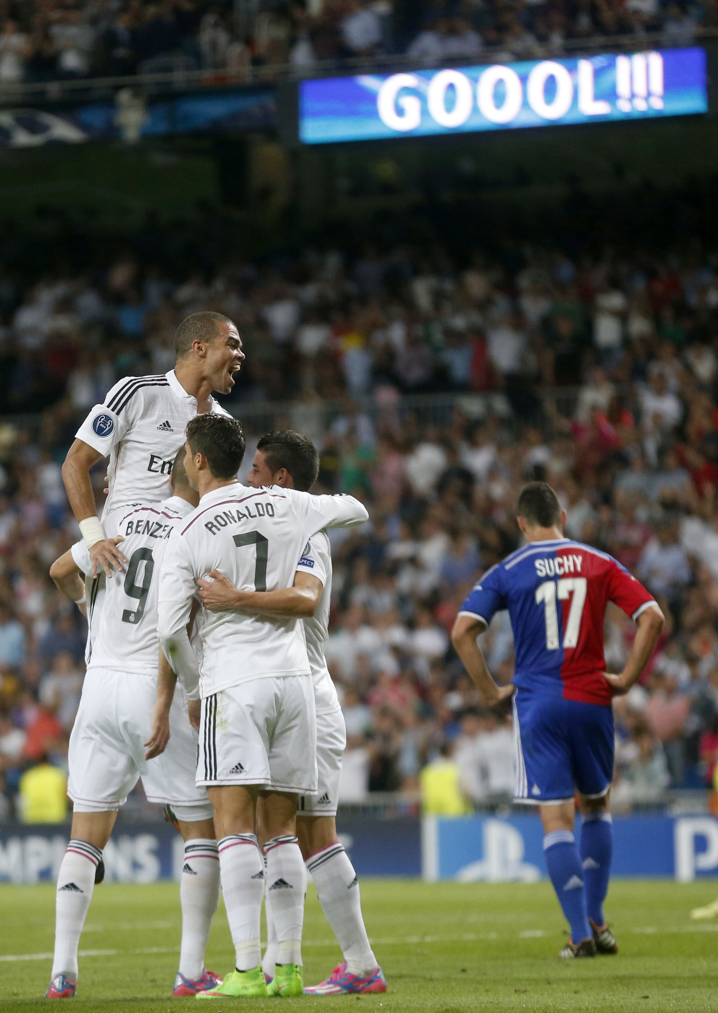 Real Madrid's players celebrate after scoring during their Champions League soccer match against FC Basel at Santiago Bernabeu stadium in Madrid September 16, 2014. REUTERS/Juan Medina (SPAIN - Tags: SPORT SOCCER)