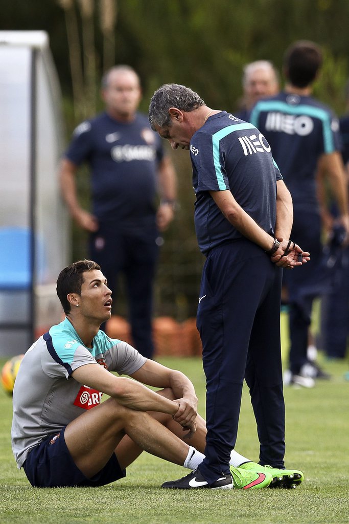 epa04435106 Portuguese national soccer team head coach Fernando Santos (R) talks with Cristiano Ronaldo (L) during their team's training session in Obidos, Portugal, 06 October 2014. Portugal will face France in an international friendly soccer match on 1