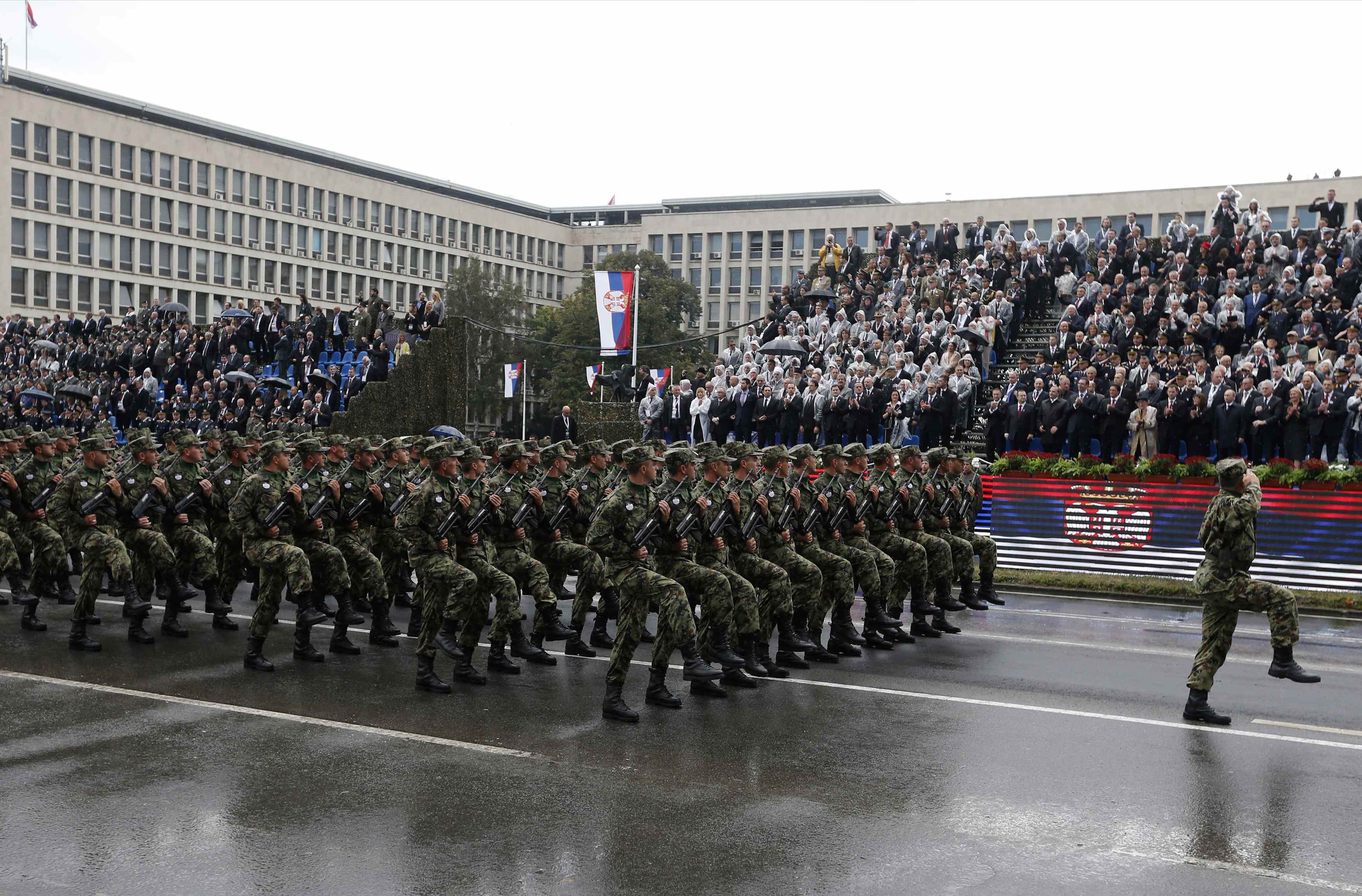 REFILE - QUALITY REPEAT Serbian troops march during a military parade to mark 70 years since the city's liberation by the Red Army in Belgrade October 16, 2014. Serbia feted Russia's Vladimir Putin with troops, tanks and fighter-jets on Thursday to mark seven decades since the Red Army liberated Belgrade, balancing its ambitions of European integration with enduring reverence for a big-power ally deeply at odds with the West. REUTERS/Marko Djurica (SERBIA - Tags: POLITICS MILITARY ANNIVERSARY)