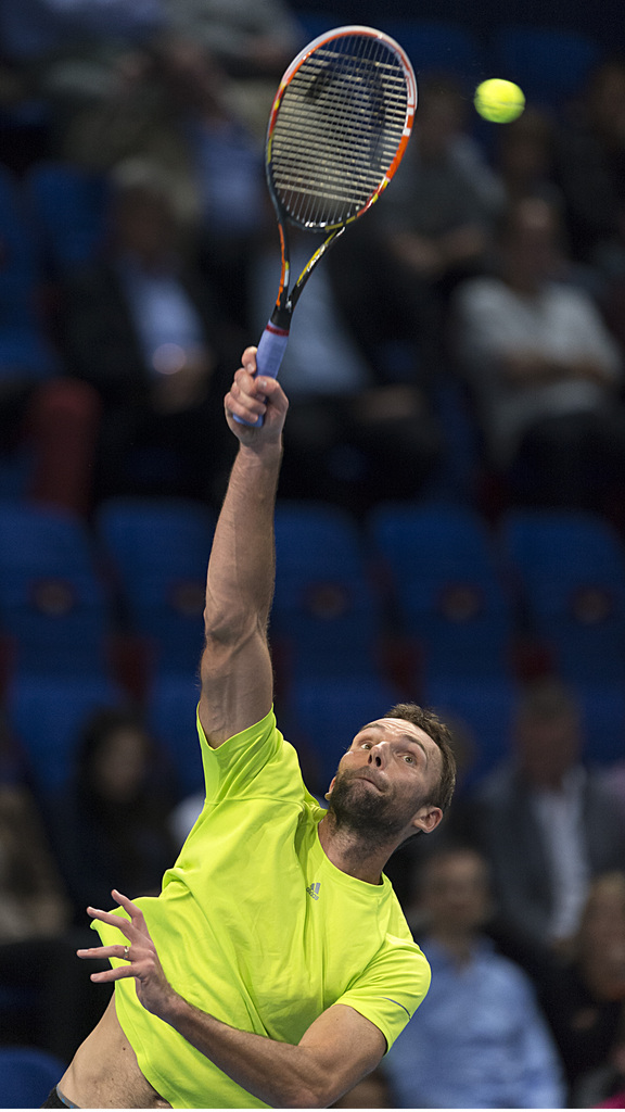 Croatia's Ivo Karlovic serves a ball to Germany's Benjamin Becker during their quarterfinal match at the Swiss Indoors tennis tournament at the St. Jakobshalle in Basel, Switzerland, on Friday, October 24, 2014. (KEYSTONE/Georgios Kefalas)
