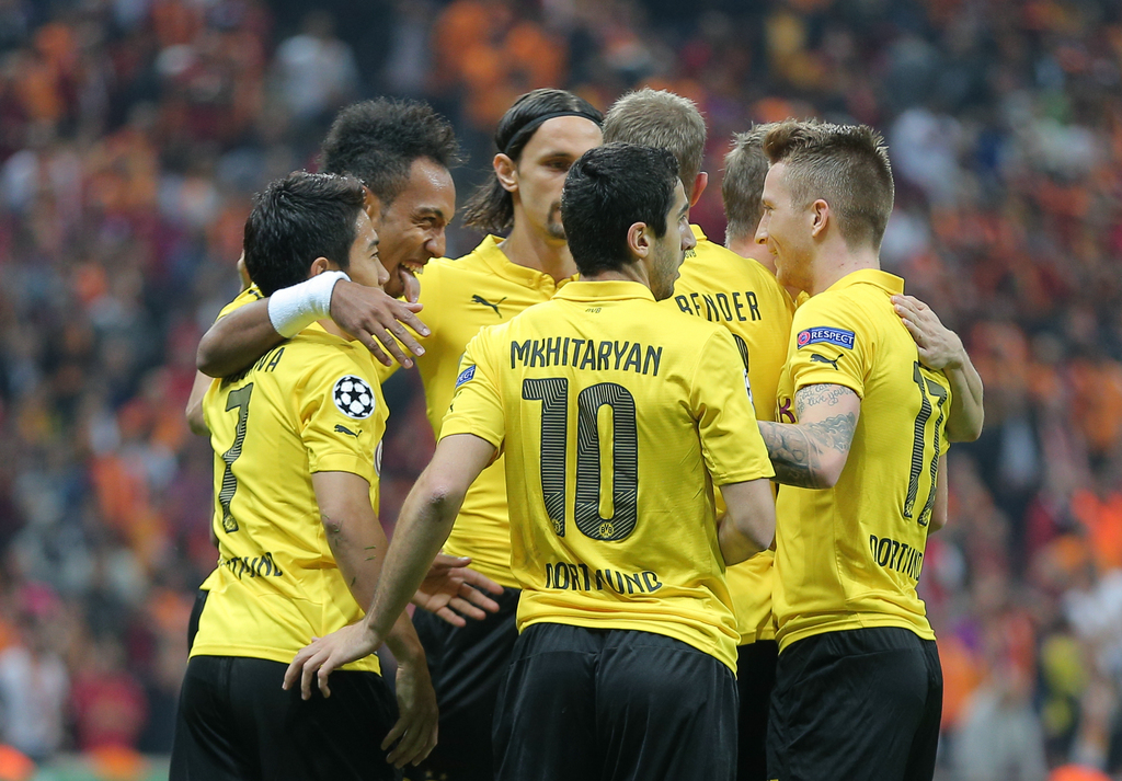 Pierre-Emerick Aubameyang of Borussia Dortmund, left-rear, celebrates with teammates after he scored during their Champions League Group D soccer match with Galatasaray at the Turk Telekom Arena Stadium in Istanbul, Turkey, Wednesday, Oct. 22, 2014.(AP Photo)