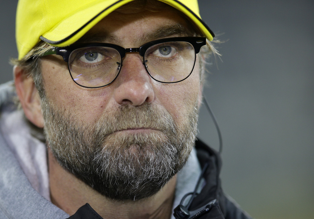 Dortmund's head coach Juergen Klopp listens to a question during a TV interview prior to the German soccer cup second round match between FC St. Pauli and Borussia Dortmund at the Millerntor Stadium in Hamburg, Germany, Tuesday, Oct. 28, 2014. (AP Photo/Michael Sohn)