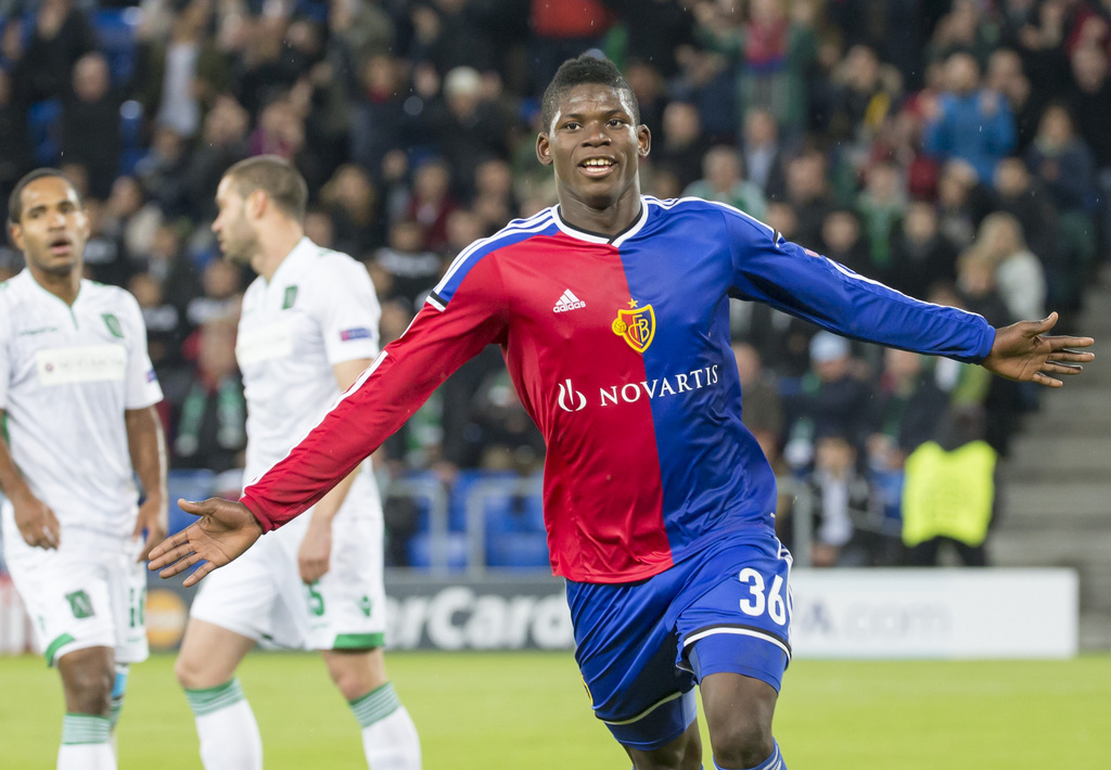 Basel's Breel Embolo, center, celebrates his first goal during an UEFA Champions League group B matchday 4 soccer match between Switzerland's FC Basel 1893 and Bulgaria's PFC Ludogorets Razgrad in the St. Jakob-Park stadium in Basel, Switzerland, on Tuesday, November 4, 2014. (KEYSTONE/Patrick Straub)