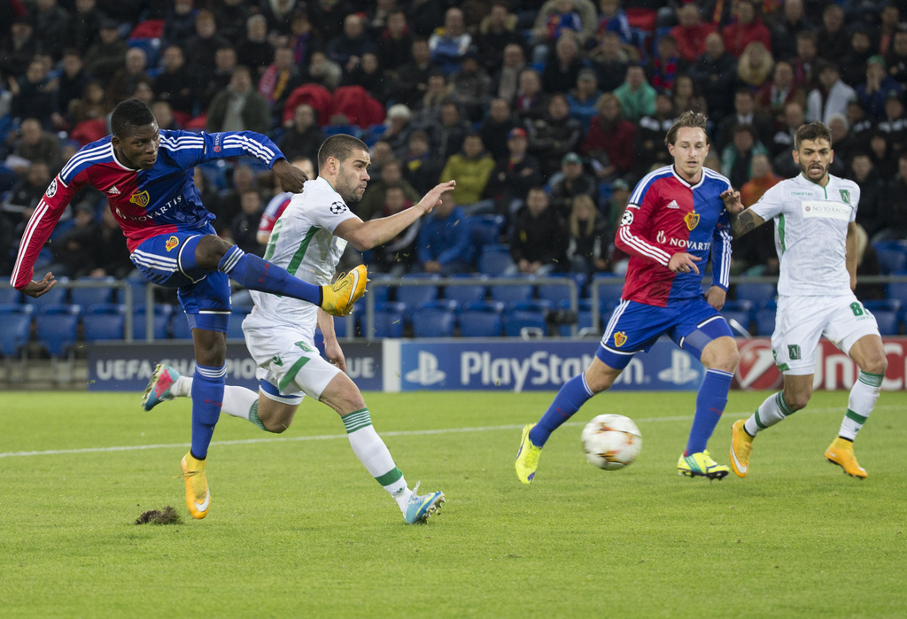 Basel's Breel Embolo, left, scores the first goal during an UEFA Champions League group B matchday 4 soccer match between Switzerland's FC Basel 1893 and Bulgaria's PFC Ludogorets Razgrad in the St. Jakob-Park stadium in Basel, Switzerland, on Tuesday, November 4, 2014. (KEYSTONE/Patrick Straub)