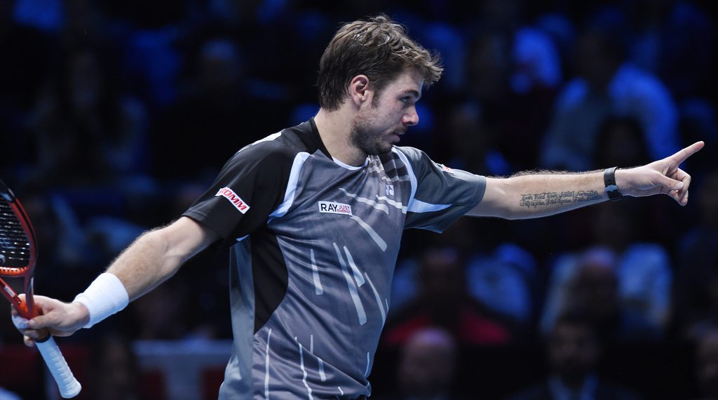epa04491496 Switzerland's Stanislas Wawrinka reacts after breaking Switzerland's Roger Federer during the ATP World Tour Finals semifinal match at the O2 Arena in London, Britain, 15 November 2014. EPA/ANDY RAIN