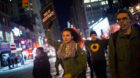 People take part in a protest against the Staten Island death of Eric Garner during an arrest in July, at midtown Manhattan i