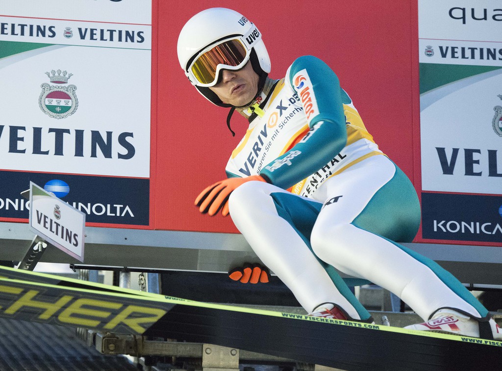 Kamil Stoch of Poland prepares for the start during the qualification at the FIS Ski Jumping World Cup in Klingenthal, Germany, Friday, Nov. 21, 2014. (AP Photo/Jens Meyer)