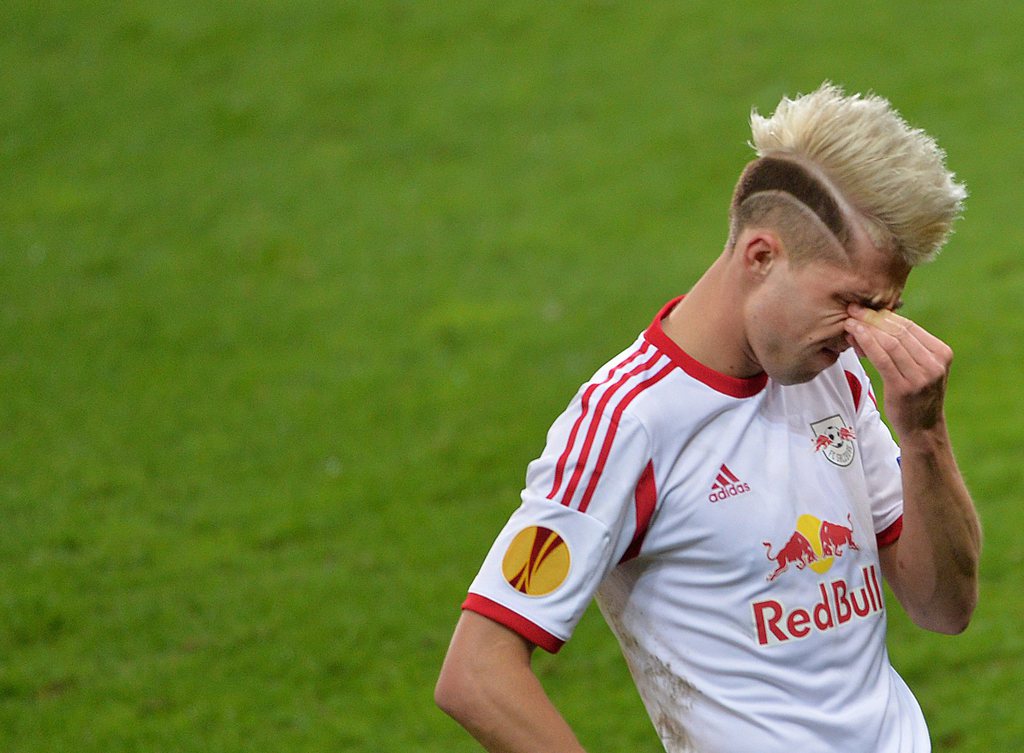 epa04134302 Red Bull Salzburg player Kevin Kampl at the end of the UEFA Europa League round of 16 second leg soccer match between Salzburg and FC Basel in Salzburg, Austria, 20 March 2014. Basel won 2-1 and advanced to the next round. EPA/BARBARA GINDL