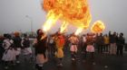 REFILE - CORRECTING YEAR 

Sikh devotees show off their fire blowing skills during a religious procession ahead of the birt