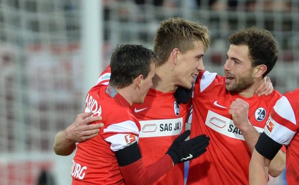 epa04597673 Freiburg's Vladimir Darida, Nils Petersen and Admir Mehmed cheer during the German Bundesliga soccer match SC Freiburg vs Eintracht Frankfurt at the Schwarzwald-Stadium in Freiburg, Germany, 31 January 2015. ..(ATTENTION: Due to the accreditation guidelines, the DFL only permits the publication and utilisation of up to 15 pictures per match on the internet and in online media during the match) EPA/PATRICK SEEGER