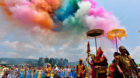 People wearing costumes attend the annual water-splashing festival to mark the New Year of the Dai minority in Jinghong, Yunn