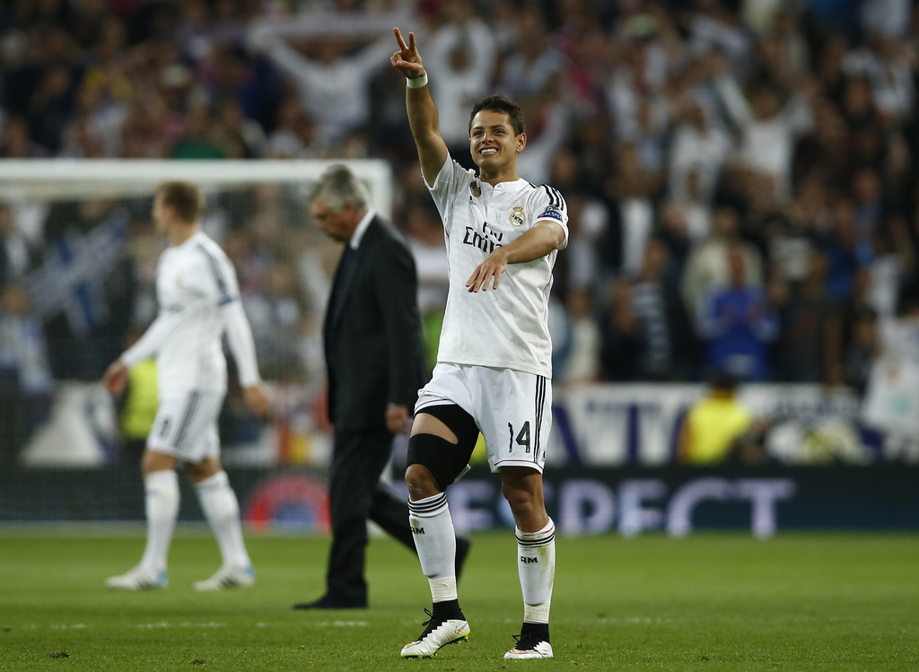 Real Madrid's Chicharito celebrates at the end of the second leg quarterfinal Champions League soccer match between Real Madrid and Atletico Madrid at Santiago Bernabeu stadium in Madrid, Spain, Wednesday, April 22, 2015. Chicharito scored the match's only goal. (AP Photo/Andres Kudacki)