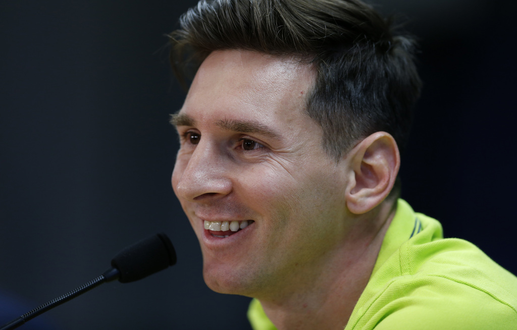 FC Barcelona's Lionel Messi, from Argentina, smiles during a press conference at the Sports Center FC Barcelona Joan Gamper in San Joan Despi, Spain, Tuesday, May 5, 2015. FC Barcelona will play against Bayern Munich in a first leg semifinal Champions League soccer match on Wednesday May 6. (AP Photo/Manu Fernandez)