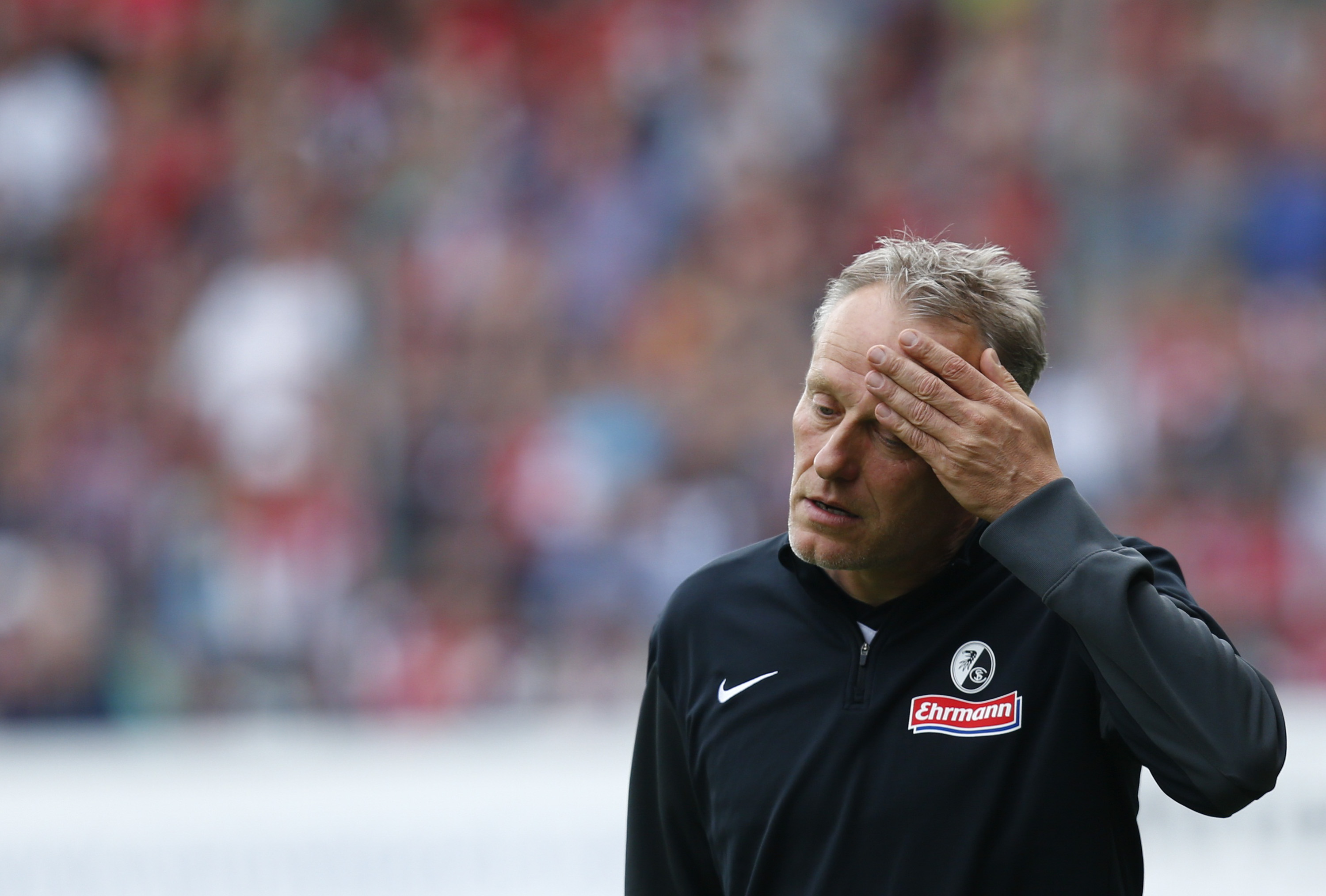 Freiburg's coach Christian Streich reacts during their German Bundesliga first division soccer match against Bayern Munich in Freiburg, Germany, May 16, 2015. REUTERS/Ralph Orlowski DFL RULES TO LIMIT THE ONLINE USAGE DURING MATCH TIME TO 15 PICTURES PER GAME. IMAGE SEQUENCES TO SIMULATE VIDEO IS NOT ALLOWED AT ANY TIME. FOR FURTHER QUERIES PLEASE CONTACT DFL DIRECTLY AT + 49 69 650050