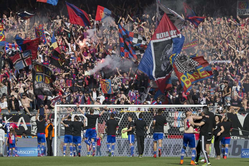 The players of FC Basel celebrate with their supporters the victory of the Super League championship after the game FC Basel against BSC Young Boys at the St. Jakob-Park stadium in Basel, Switzerland, Sunday, May 17, 2015. FC Basel won the sixth time in series the Swiss Championships. (KEYSTONE/Patrick Straub)