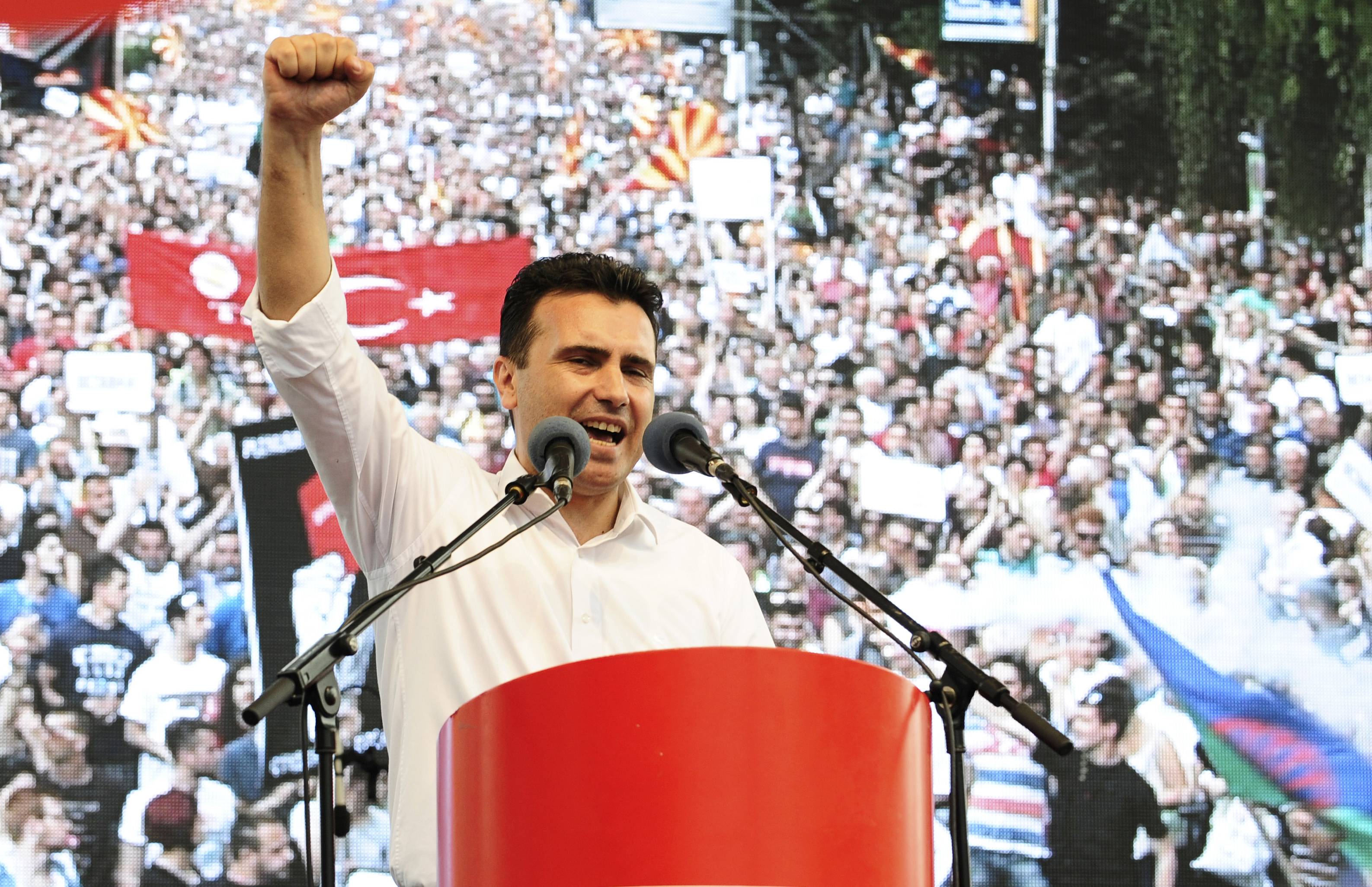 Opposition Social Democrat leader Zoran Zaev delivers a speech in front of a video screen during an anti-government demonstration in Skopje, Macedonia, May 17, 2015. Tens of thousands of protesters took to the streets of Macedonia's capital on Sunday, waving Macedonian and Albanian flags in a dramatic display of ethnic unity against a government on the ropes after months of damaging wire-tap revelations. REUTERS/Ognen Teofilovski