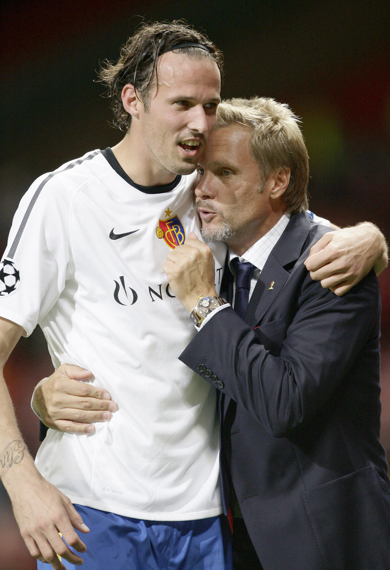 FC Basel manager Thorsten Fink, right, celebrates with Marco Streller after drawing against Manchester United in their Champions League group C soccer match at Old Trafford, Manchester, England, Tuesday Sept. 27, 2011. (AP Photo/Jon Super)