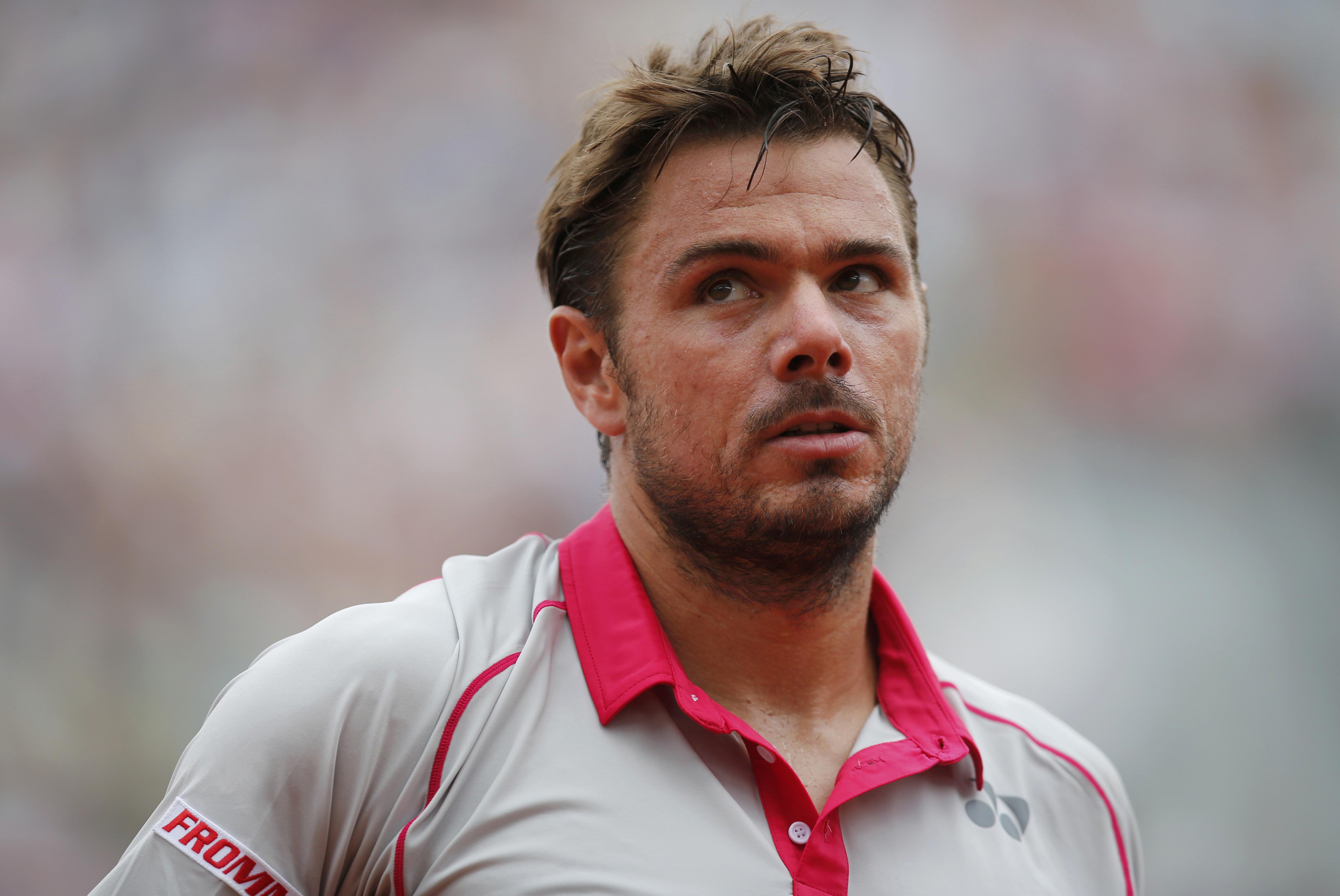 Stan Wawrinka of Switzerland reacts during their men's singles match against Marsel Ilhan of Turkey at the French Open tennis tournament at the Roland Garros stadium in Paris, France, May 24, 2015. REUTERS/Jean-Paul Pelissier