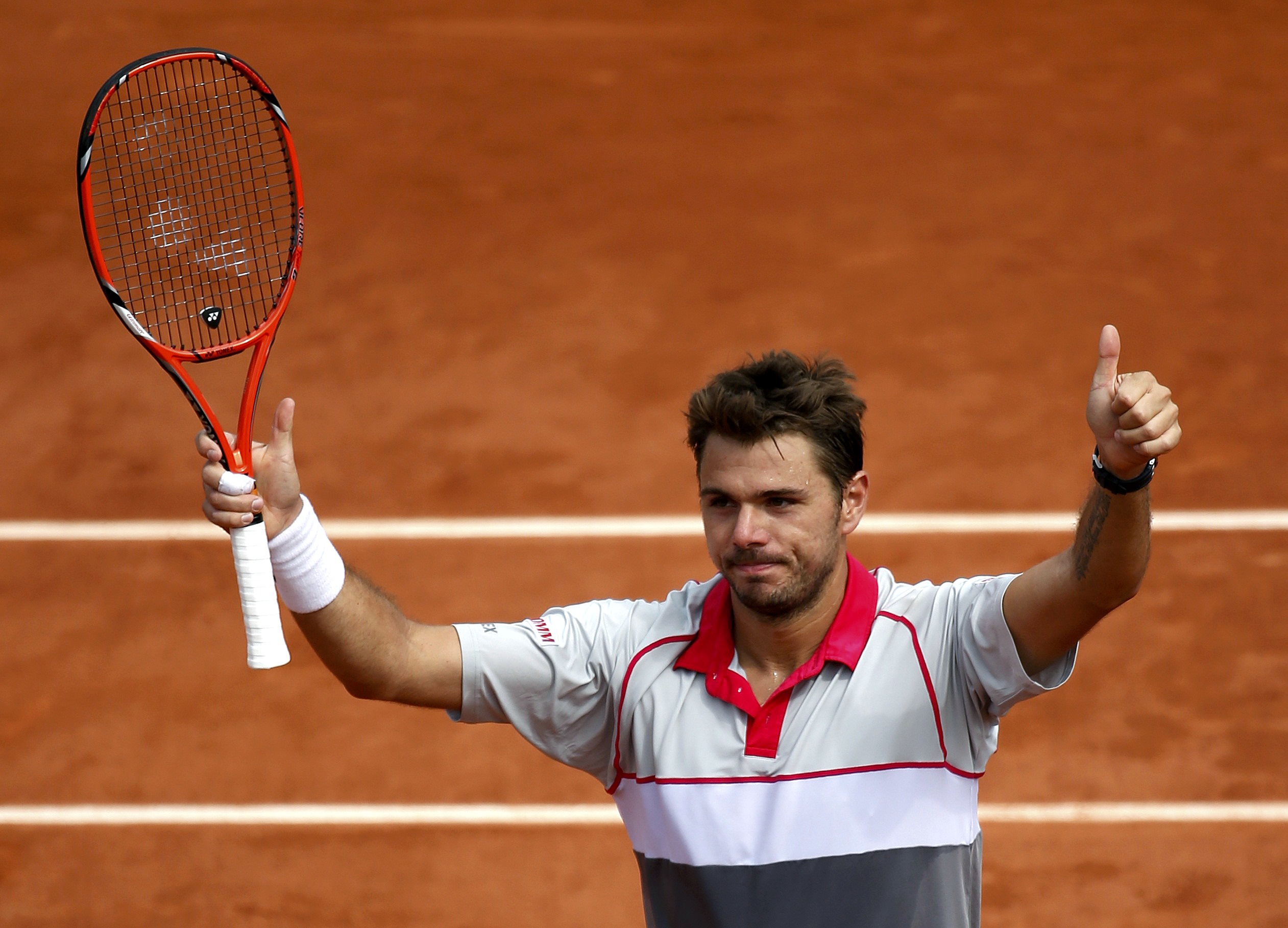 Stan Wawrinka of Switzerland celebrates after beating Steve Johnson of the U.S. during their men's singles match at the French Open tennis tournament at the Roland Garros stadium in Paris, France, May 29, 2015. REUTERS/Vincent Kessler
