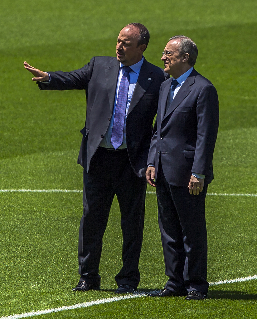 New Real Madrid coach Rafael Benitez, left, and Real Madrid's President Florentino Perez, talks during his official presentation at the Santiago Bernabeu stadium in Madrid, Spain, Wednesday, June 3, 2015, after signing for Real Madrid. (AP Photo/Andres Kudacki)