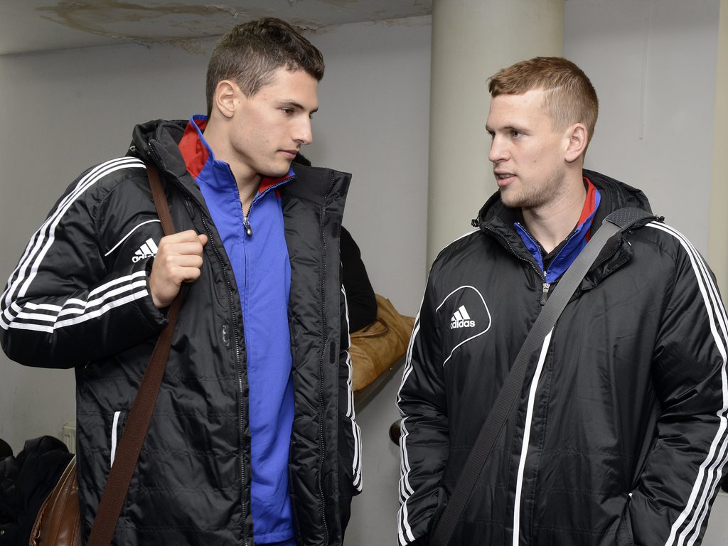 Fabian Schaer, left, and Fabian Frei, right, of Switzerland's FC Basel at their arrival at the airport of Dnipropetrovsk, Ukraine, on Wednesday, February 20, 2013. Switzerland's FC Basel 1893 is scheduled to play against Ukraine's FC Dnipro Dnipropetrovsk in an UEFA Europa League round of 32 second leg soccer match on Thursday, February 21, 2013. (KEYSTONE/Georgios Kefalas)