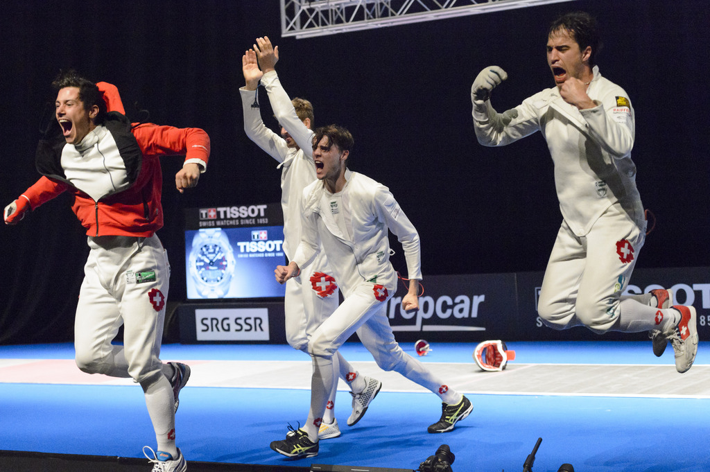 Switzerland's Fabian Kauter, Benjamin Steffen, Peer Borsky and Max Heinzer, from left, celebrate the bronze medal after defeating Ukraine during the men's team epee final for the third place at the European Fencing Championships in Montreux, Switzerland, Wednesday, June 10, 2015. (KEYSTONE/Laurent Gillieron)